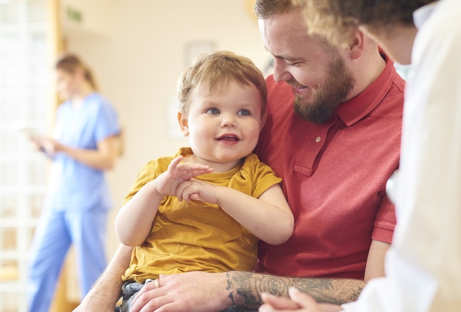 A man holding his young child