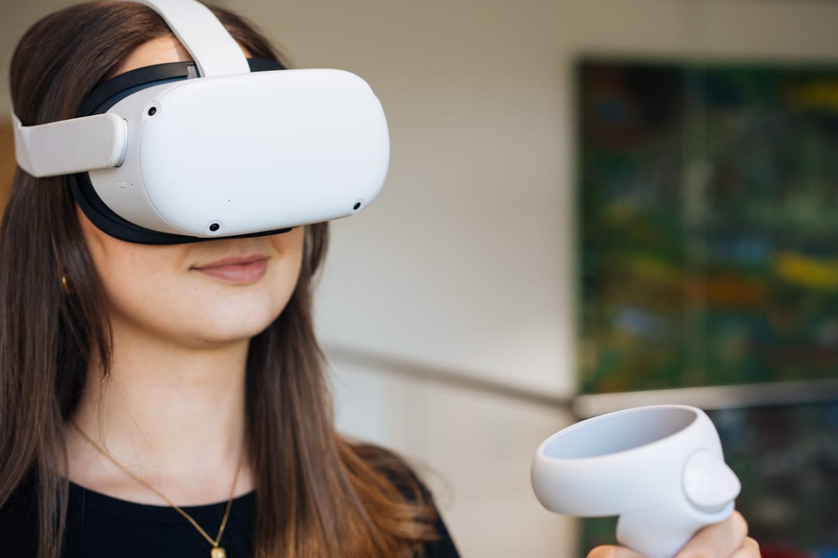 Young woman wearing VR equipment